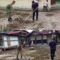 Membersihkan Kantor Geuchik, Babinsa Koramil 08/Arongan Lambalek Ajak Warga Gotong Royong